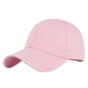 Detail of pink cotton 6-panel baseball cap showing curved brim and top ventilation eyelets
