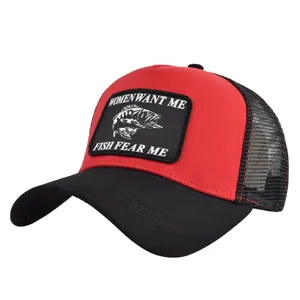 Close-up of red mesh trucker hat featuring embroidered Women Want Me Fish Fear Me patch