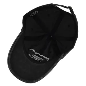 Internal view showing 100% cotton stitching, metal rivets, and adjustable buckle of the cap