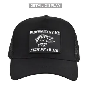 Close-up of fishing patch on black trucker hat with mesh and curved brim detail