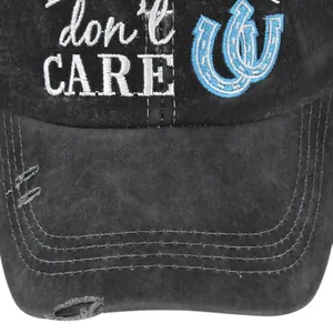 Détail de la casquette grise brodée don't CARE avec un style vintage usé et mesh