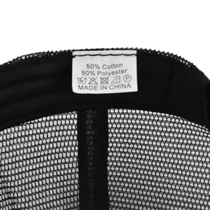 Detail shot of the care label inside the black mesh trucker hat showing material and care icons