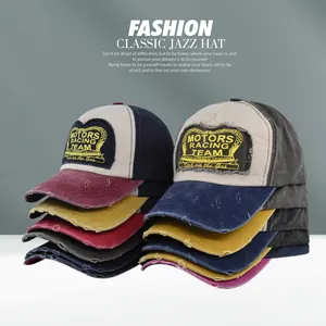 Detail of vintage MOTORS RACING TEAM embroidery on distressed canvas baseball cap