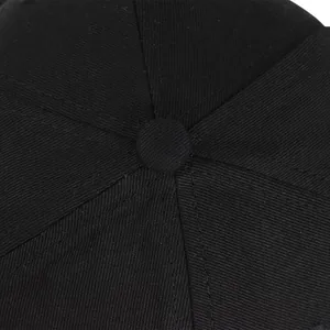 Detailed top view of a black cotton twill baseball cap showing stitching and top button