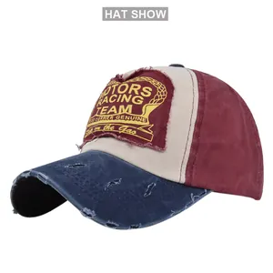 Detail of vintage motors racing patch and distressed fabric on a tricolor baseball cap