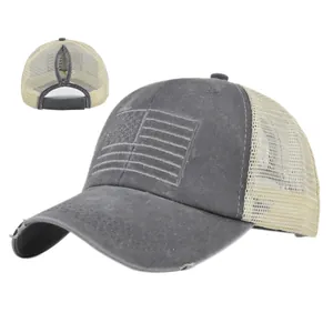 Detail of grey ponytail baseball cap with mesh back and embroidered American flag design