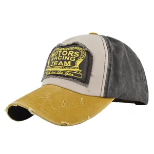 Detailed close-up of distressed brim and Motors Racing Team patch on trucker cap