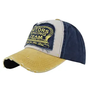 Detail of vintage MOTORS racing patch and distressed yellow brim on mesh baseball cap