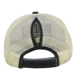 Detail of cream mesh trucker hat featuring a functional ponytail opening and adjustable strap