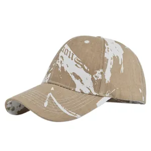Detailed macro view of khaki tie-dye canvas baseball cap with Famous graffiti print