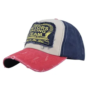 Detailed macro of vintage MOTORS racing team patch and distressed brim on baseball cap