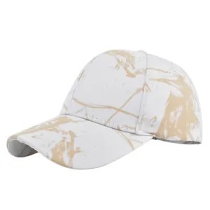 Detail of a six-panel tie-dye baseball cap featuring a marble-like texture in light brown