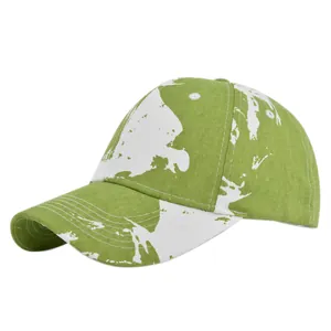 Detailed side view of tie-dye baseball cap with green marble print and reinforced stitching