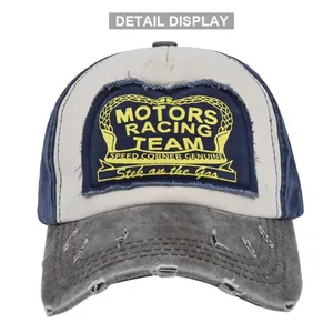 Close-up of MOTORS RACING TEAM embroidery on a vintage distressed baseball cap
