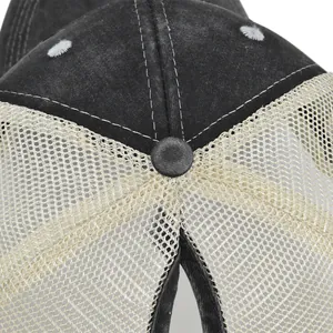 Detail of ponytail hole and mesh back on black vintage baseball cap with precise stitching
