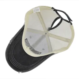 Internal detail of washed ponytail baseball cap with mesh back and quality stitching