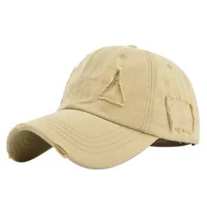 Detailed view of frayed edges and triangular cutout on khaki vintage distressed baseball cap