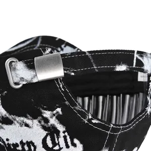 Detail of adjustable silver metal buckle on tie-dye street art style baseball cap