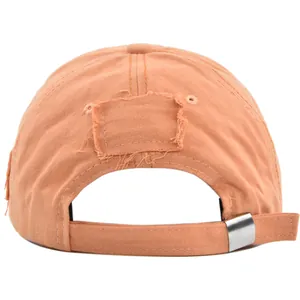 Detail of vintage washed cotton baseball cap with frayed distressing and metal buckle