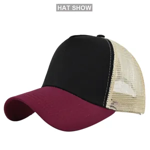 Detailed side view of five-panel trucker hat with mesh back and curved brim