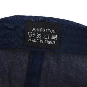 Detailed close-up of 100% cotton washing label and stitching on the baseball cap