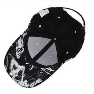 Detail of internal cotton structure and wash label of black and white tie-dye baseball cap