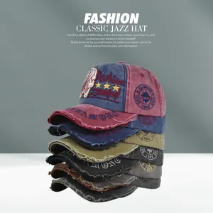 Detailed stack of vintage washed baseball caps in red, navy, army green and black