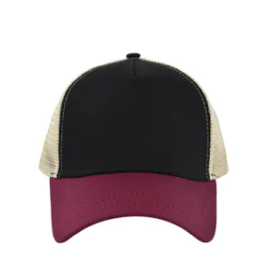 Detail of five-panel trucker hat showing contrast stitching and breathable mesh material