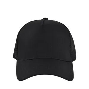 Detail of breathable mesh panel and sturdy visor on a solid black trucker hat