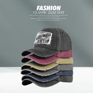 Vertical stack of six distressed cotton baseball caps in multiple retro colors with patches
