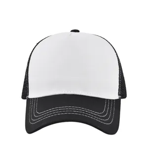 Detail of classic black and white trucker hat featuring breathable mesh and stitched brim