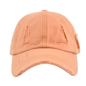 Retro washed cotton baseball cap in light orange with distressed ripped edge details