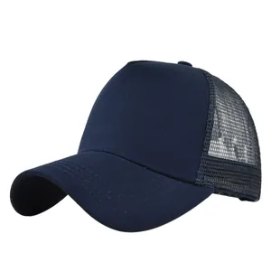 Detail view of the breathable mesh back and curved brim on a navy trucker baseball cap