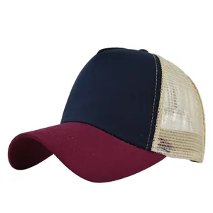 Close-up of tricolor mesh trucker hat with reinforced stitching on the curved brim
