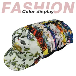Detailed view of assorted fashion baseball caps featuring tropical botanical and floral prints