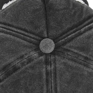 Detailed macro view of the distressed cotton baseball cap crown with reinforced stitching