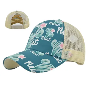 Detail of teal cactus print ponytail cap with cross elastic bands for high buns