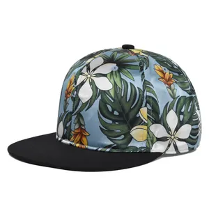 Flat brim snapback hat with tropical floral satin patterns and contrasting black peak