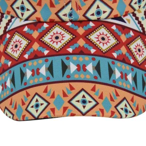 Detailed macro view of colorful geometric tribal patterns on the front of a ponytail cap