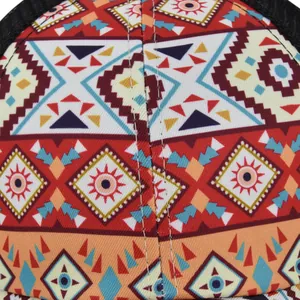 Front detail of ponytail mesh sun hat featuring colorful bohemian geometric patterns
