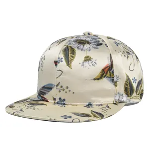 Detailed view of satin-finish baseball cap with intricate floral and bird embroidery