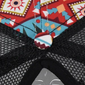Macro shot of ethnic pattern baseball cap showing fabric button and breathable mesh