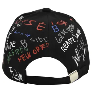 Rear view of black baseball cap featuring colorful street graffiti print and top button