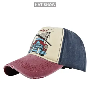 Detail of vintage baseball cap with distressed burgundy brim and retro truck print