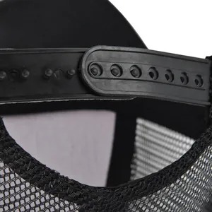 Detail of adjustable black snapback strap and breathable mesh fabric on trucker hat