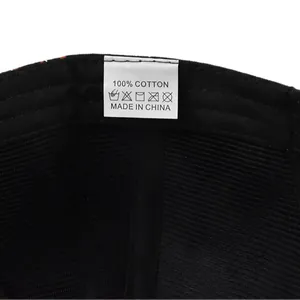 Detail of 100% cotton material tag and washing instructions inside baseball cap