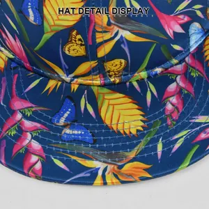 Detailed macro view showing tropical floral print and precise stitching on the navy cap