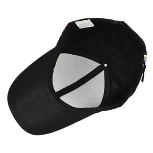 Detail view of the black cotton baseball cap interior with wash label and sweatband