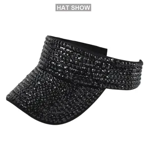 Detailed side view of black sun visor hat with full rhinestones and mesh texture