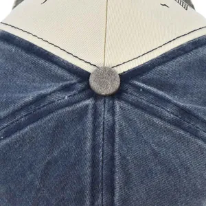 Macro view of the contrast color baseball cap top showing stitching and washed cotton texture